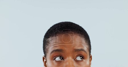 Photo for Idea, space and eyes with woman in studio for mockup, planning and opinion. Question, why and confused with closeup face of african person thinking on grey background for guide, remember and choice. - Royalty Free Image