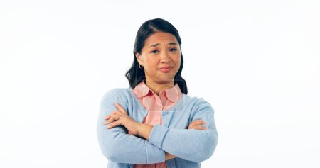 Photo for Portrait, attitude and an asian woman arms crossed in studio isolated on a white background for rejection. Angry, frustrated or deny with an unhappy young person looking moody, negative or annoyed. - Royalty Free Image