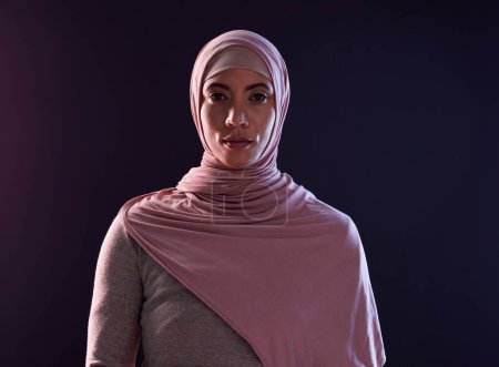 Photo for Muslim woman, portrait and hijab in faith for religion, islam or praise against a dark studio background. Face of Islamic female person or model with scarf in fashion for cultural tradition on mockup. - Royalty Free Image