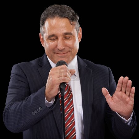 Photo for Microphone, speaker and business man on black background for presentation, speech and seminar. Professional, public speaking and worker talking for conference, tradeshow and communication in studio. - Royalty Free Image