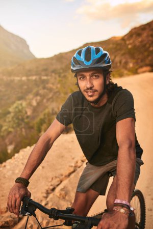 Photo for The best invention after the wheel Putting two together. Portrait of a young man cycling along a trail - Royalty Free Image