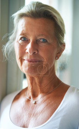 Photo for Senior, woman and portrait for natural beauty confidence in age care, grace wrinkles in home. Old person, face and pride eyes in retirement as pensioner in house for calm peace, rest memory or relax. - Royalty Free Image