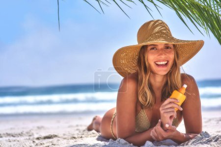 Photo for At the beach. A beautiful, young woman relaxing at the beach - Royalty Free Image