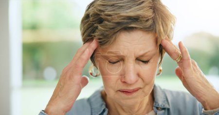 Photo for Frustrated senior woman, headache and mistake in stress, burnout or anxiety and depression at home. Closeup of mature female person with migraine, pain or sore head in mental health or fail at house. - Royalty Free Image