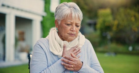 Photo for Heart attack, pain and senior woman in a garden with hands on chest, anxiety or breathing problem. Cardiac arrest, stress and old lady outdoor retirement home with asthma, heartburn or lung disease. - Royalty Free Image