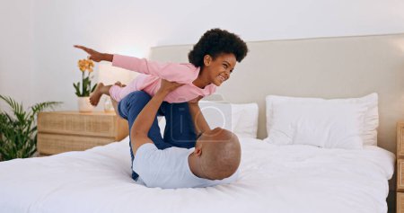 Photo for Bedroom, airplane and black family, father and happy child playing, having fun and enjoy fun flying game for home wellness. Bed, happiness and bonding dad, relax kid or girl imagine plane flight. - Royalty Free Image