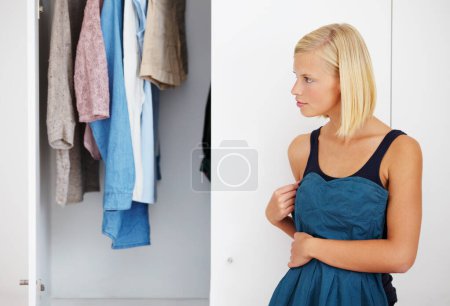 Photo for Woman, mirror or choosing clothes in closet for morning routine, fashion or clothing in bedroom of home. Person, outfit selection or decision for dress, garment idea or style in wardrobe or apartment. - Royalty Free Image