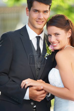 Photo for Wedding, portrait and bride and groom hug with love, celebration or union, romance or outdoor garden ceremony. Commitment, marriage and face of couple with support, trust and security or life event. - Royalty Free Image