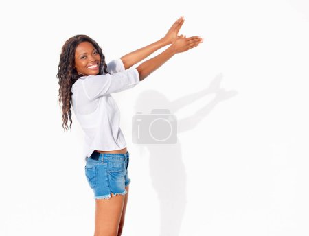 Photo for Bird shadow, black woman and portrait with hands in wings shape flying in a studio. Happy, smile and African female person with modern and casual fashion hand gesture for creative puppet show. - Royalty Free Image