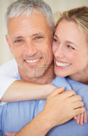 Photo for Happy couple, portrait and hug for love, support or care in romance together on holiday weekend at home. Face of mature married woman hugging man with smile in embrace, bonding or honeymoon at house. - Royalty Free Image