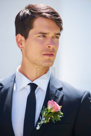 Photo for Groom man, thinking and outdoor at wedding in suit, rose or flower for celebration, event or party. Person, vision and ideas for choice, marriage or commitment to relationship with floral decoration. - Royalty Free Image