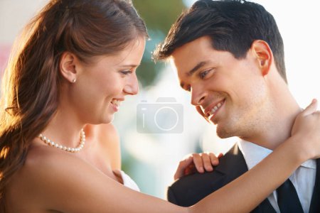 Photo for Bride woman, hug groom and wedding with smile, care and excited with love, care and fresh start in sunshine. Couple, memory and commitment to marriage in summer, outdoor and together for celebration. - Royalty Free Image