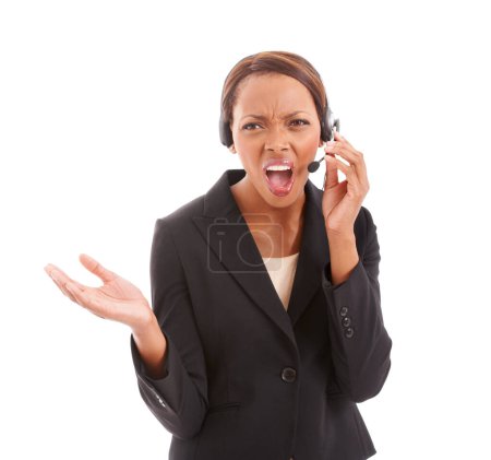 Photo for Frustrated black woman, call center and headphones shouting at difficult customer against a white studio background. African female person, consultant or agent screaming or yelling on headset mic. - Royalty Free Image
