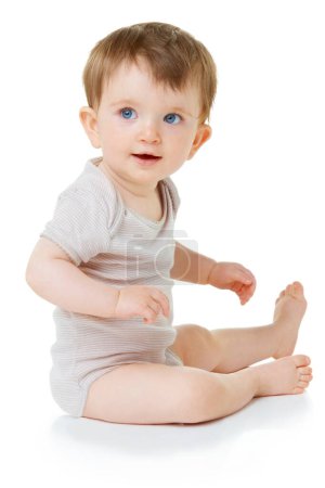 Photo for Cute, youth and happy with baby on floor of studio for curious, child development and learning. Explore, smile and young with infant crawling in white background for toddler, innocence and health. - Royalty Free Image