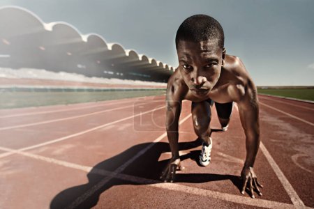 Photo for Man, runner and starting line for race, face and ready for marathon, sports and sprint or competition. Black male person, training and exercising or active, practice and outdoors for fitness on track. - Royalty Free Image