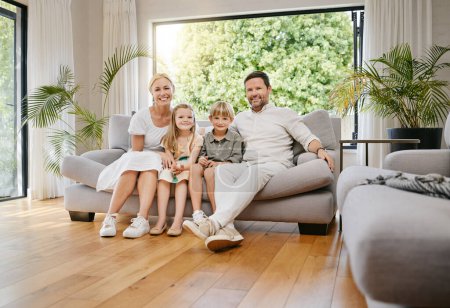 Photo for Smile, happy and portrait of children with parents on a sofa relaxing in the living room of modern house. Bonding, love and young kids relaxing, resting and sitting with mother and father at home - Royalty Free Image