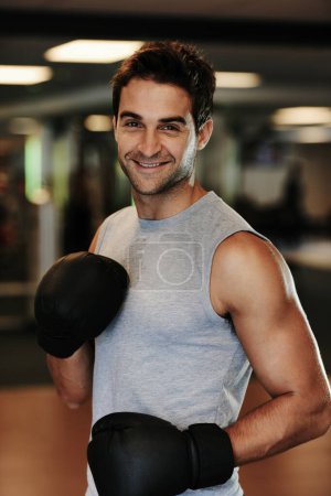Photo for Man, boxing gloves and training with gym portrait with smile, wellness or exercise for fight, performance or sport. MMA, boxer and happy for contest, competition or workout for development with sweat. - Royalty Free Image