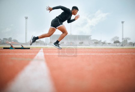 Photo for Man, athlete and ready for race on track with practice, training or exercise for competition. Black person, runner and fast with dedication, determination and passion on face with speed for sport. - Royalty Free Image