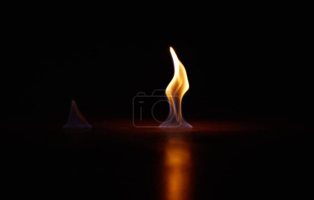 Photo for Flame, heat and fire start with black background with sparks, smoke and light from burning in studio. Fuel, flare and glow from thermal power and art in the dark with creativity and inferno with burn. - Royalty Free Image
