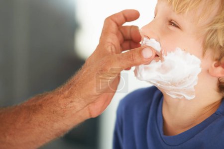Photo for Shaving, dad and child with cream on face, smile and bonding in home with morning routine. Teaching, learning and father with happy son in bathroom for facial shave, clean fun and grooming together - Royalty Free Image