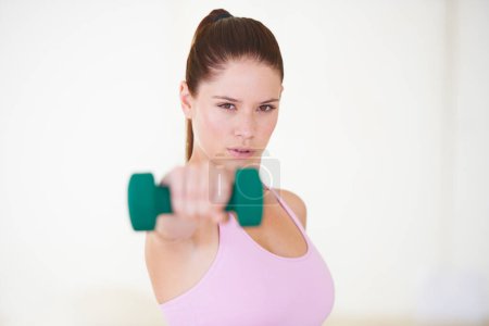 Photo for Portrait, dumbbell and woman with fitness, training and exercise on a white studio background. Face, person and girl with equipment, progress and challenge with wellness, performance and workout. - Royalty Free Image
