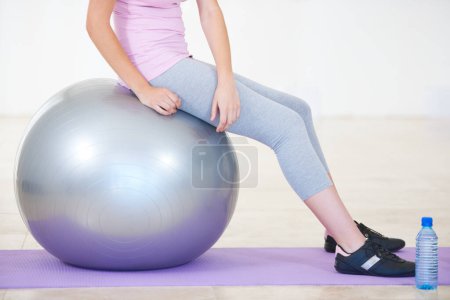 Photo for Woman, ball and balance or exercise on mat for .cardio or progress training, workout for fitness. Female person, sports for gym club or active healthy, strong wellbeing challenge for performance gear. - Royalty Free Image