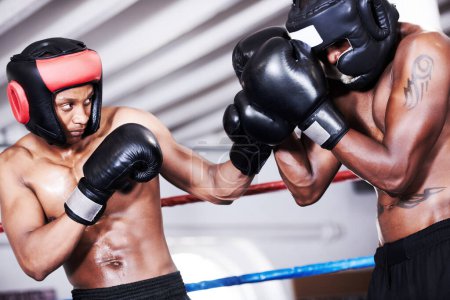 Photo for Boxing, black man and sparring partner in ring together with headgear, gloves and fitness, power training, challenge. Strong body, fighting and boxer in helmet, fearless and confident in competition - Royalty Free Image