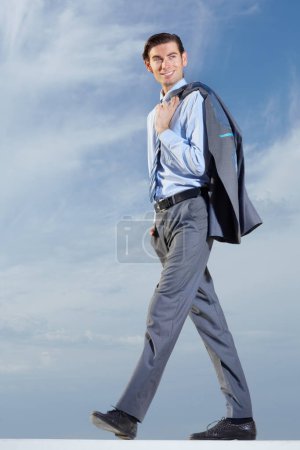 Photo for Businessman, walk and smile in happiness with suit for ambition, vision or idea for future growth. Corporate, male manager and consultant with jacket over shoulder for cool, trendy and confident pose. - Royalty Free Image