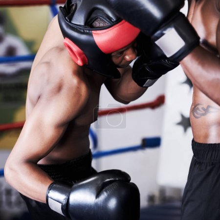 Photo for Boxing, black man and sparring partner in gym together with helmet, gloves and fitness, power training and challenge. Strong body, fighting and boxer in ring with coach, hit and action in competition. - Royalty Free Image