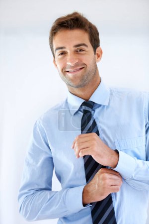 Photo for Businessman, portrait and happy or dressing with shirt, professional or employee at corporate job. Entrepreneur, face and person for smile, confidence and pride with calm expression or hands at work. - Royalty Free Image
