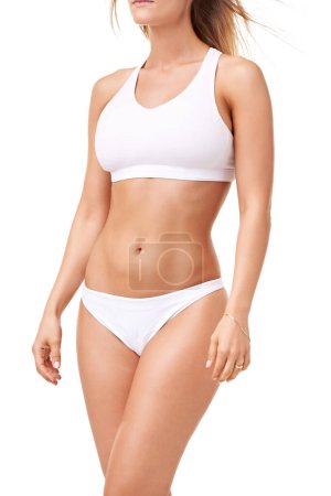 Photo for Health, fitness and body of woman in underwear for wellness, skincare and diet in studio. Confidence, stomach and isolated person in lingerie for cosmetics, lose weight and beauty on white background. - Royalty Free Image