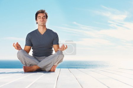 Photo for Yoga, blue sky and relax man meditate for spiritual mindset healing, chakra energy balance or outdoor summer freedom. Mockup mindfulness space, beach patio and yogi peace, calm and zen for wellness. - Royalty Free Image