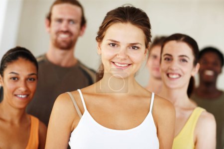 Photo for Portrait, smile or fitness and woman with a group of people in a studio for health, wellness or mindfulness. Exercise, training and pilates with happy young friends together in gym class for workout. - Royalty Free Image