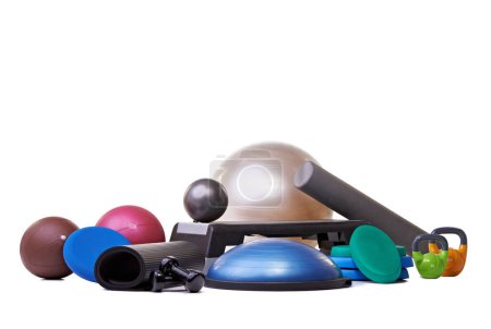 Photo for Studio, gym equipment and fitness in mockup for sport, training and exercise for health lifestyle. Hand weights, accessories and ball with dumbbell or yoga mat and gym gadgets by white background. - Royalty Free Image