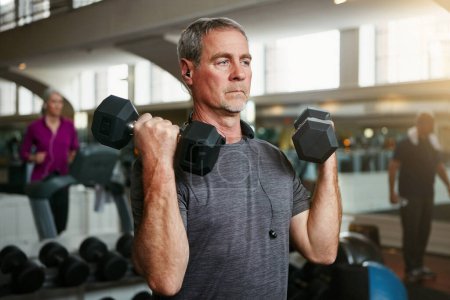 Photo for Senior fitness, old man and dumbbells at a gym for weightlifting, challenge or workout, training or bodybuilding. Biceps, arms and elderly person with hand weight for strength, mindset or exercise. - Royalty Free Image
