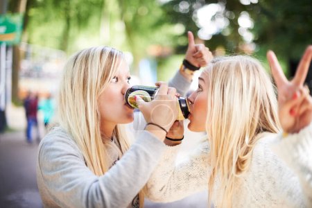 Photo for Beer can, festival friends and women drinking for fun together, soda cooldrink beverage or outdoor social event. Summer music concert, party emoji sign and drunk people with alcohol drinks contest. - Royalty Free Image