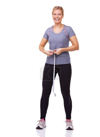 Photo for Portrait, woman and tape measure for fitness with weight loss progress, happy and exercise results in studio. Person, usa and smile face with health body, gym clothes and wellness by white background. - Royalty Free Image
