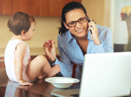 Photo for Businesswoman, phone call and baby with laptop for feeding in kitchen for remote work, productivity and job. Mother, freelancer and technology for communication while multitasking with childcare. - Royalty Free Image