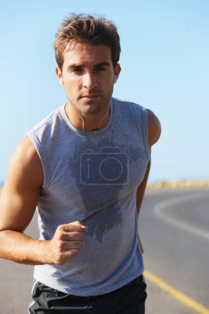 Photo for Sports, sweat and man athlete in mountain running for race, marathon or competition training. Fitness, workout and body of male runner doing a cardio exercise for health or wellness in outdoor nature. - Royalty Free Image