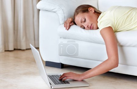 Photo for Woman, couch and laptop for sleeping in home, scroll or relax with click, tired or burnout in lounge. Girl, person and lying on sofa, choice and living room with pc on floor to watch film in house. - Royalty Free Image