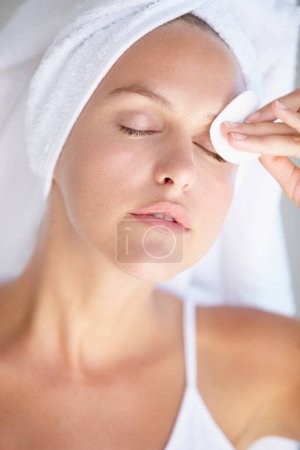 Photo for Skincare, woman or cotton pad to remove makeup or dirt with luxury skin product in home bathroom. Dermatology, model or female person cleaning in facial beauty spa treatment for cosmetics or wellness. - Royalty Free Image