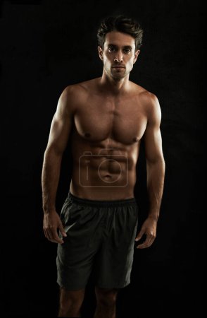 Photo for Topless, black background or portrait of man with six pack, strong abs or stomach in studio. Fitness model, cool or ripped male person with healthy body, dark shadow or abdomen muscle for wellness. - Royalty Free Image