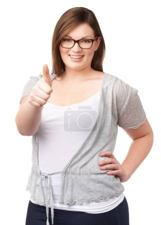 Photo for Glasses, portrait and plus size model with thumbs up, smile and casual fashion on white background. Self love, body positivity and happy woman with agreement, thank you or yes hand gesture in studio - Royalty Free Image