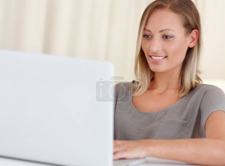 Photo for Girl, laptop and happy for remote work from home, scroll and thinking with freelance copywriting job. Woman, computer and entrepreneur with planning, schedule and brainstorming with reading in house. - Royalty Free Image