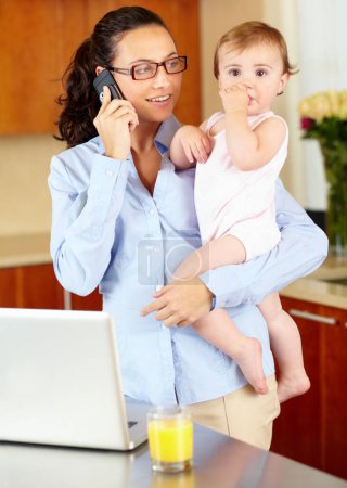 Photo for Mother, baby and phone call for home planning, career management and laptop in kitchen for multitasking. Single mom or freelancer on mobile and computer for job search, chat and financial opportunity. - Royalty Free Image