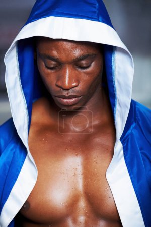 Photo for Black man, boxing champion and robe getting ready for fight, challenge or sports competition at gym. Face of serious African male person, fighter or professional boxer in MMA, match or game start. - Royalty Free Image