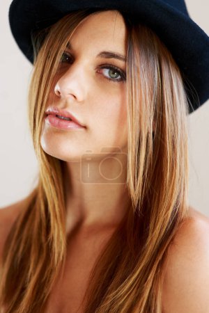 Photo for Hipster, hat and portrait of woman with vintage, fashion and confidence in white background or studio. Retro, style and face of person in old fashioned fedora with makeup, cosmetics and beauty. - Royalty Free Image
