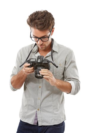 Photo for Man, camera and photographer in studio for lens adjust or creative vision, capture hobby or white background. Male person, digital equipment and picture art on mockup space, professional or skill. - Royalty Free Image