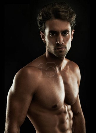 Photo for Topless, black background or portrait of man for bodybuilding results, six pack or stomach in studio. Fitness model, dark or ripped person with healthy body, abs or muscle for wellness in Italy. - Royalty Free Image