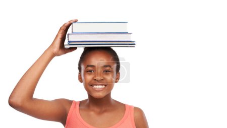 Photo for Portrait, smile and black girl with books on her head, education and balance isolated on a white studio background. Face, African person and model with mockup space and learning with knowledge. - Royalty Free Image